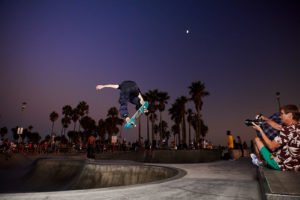 Skateboarder in halfpipe bowl Venice